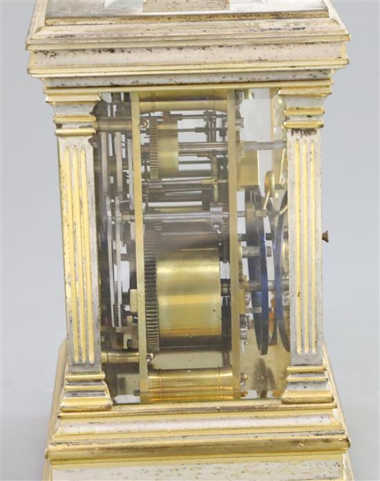 An early 20th century French silvered and parcel gilt hour repeating carriage alarum clock, 7in.